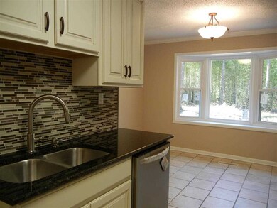 Enjoy a lovely view of the backyard from the breakfast area and kitchen.