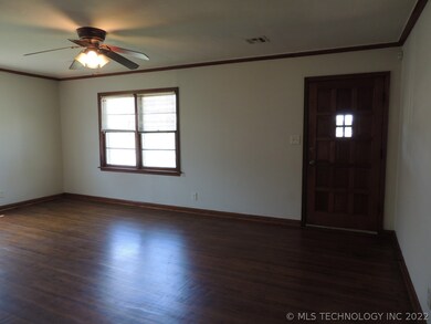 The front door opens to beautiful hardwood floors