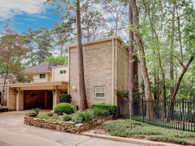 Tucked away in this wooded enclave, this corner un