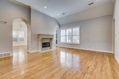 Elegant Living Room has limestone Fireplace, grani