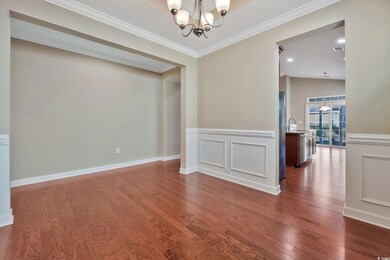 Unfurnished dining room with new paint, wainscotin