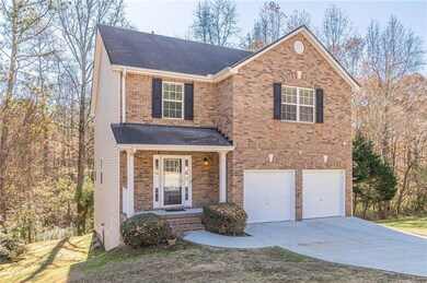 View of property featuring a garage