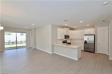 Kitchen featuring stainless steel appliances, base