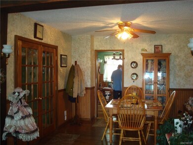 French doors lead from front foyer to dining room