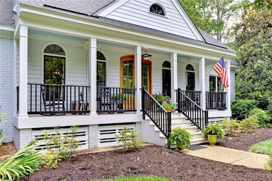 View of exterior entry featuring covered porch