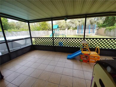 Nice sized screened room with view of the fenced b