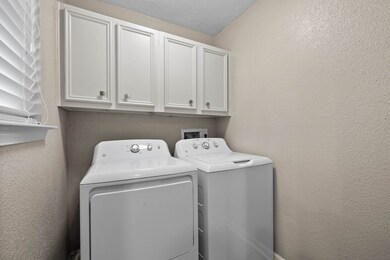 Utility room with storage and washer-dryer include