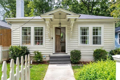 View of front facade featuring a chimney