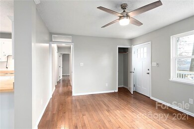 Coat Closet at Entry and Hallway Connecting Three Bedrooms