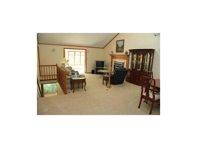 Spacious livingroom looks out to sunroom