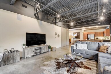 Living room featuring concrete flooring