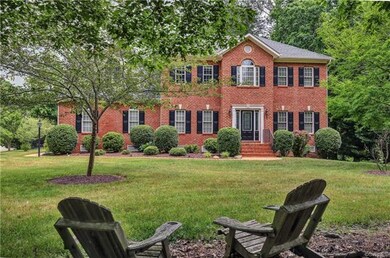 Home includes beautiful brick front facing on a .8