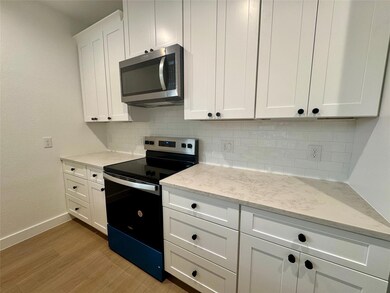 Kitchen with stainless steel microwave, electric 