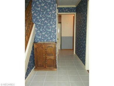 Greet guests in this spacious foyer which leads to