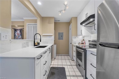 Pretty stone backsplash and tile flooring.