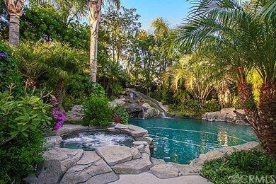 Lush landscape is perfect backdrop for pool & jacu
