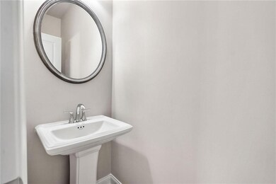 Bathroom with baseboards and a sink