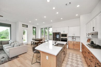 Modern open-concept kitchen and living area with l