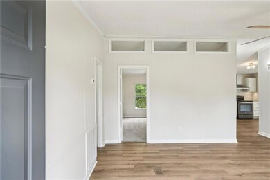 Spare room featuring light wood-style flooring, a 