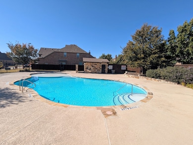 Community pool featuring a patio area 200 feet away