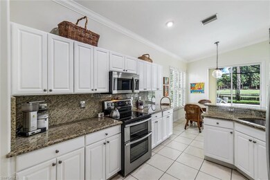 Kitchen featuring white cabinets, stainless steel 