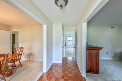 Parquet floor in foyer welcomes you home.