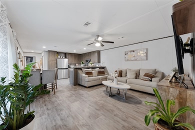 Living open to kitchen and dining