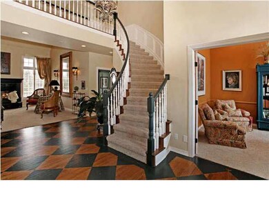 Entry, wood floor, one of two stairways to upstair
