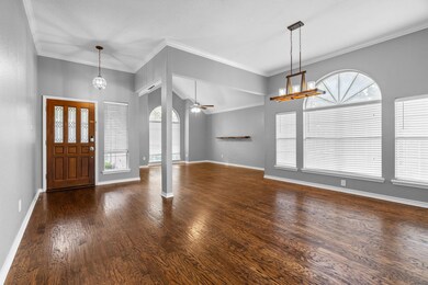 Foyer entrance featuring ceiling fan with notable 