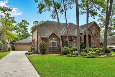 The detached garage has plenty of space for two cars and the long driveway affords room for extra parking.