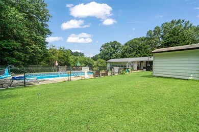 View of yard featuring view of wooded area