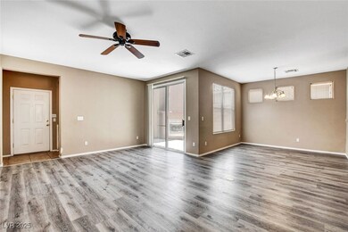 Empty room with a chandelier, plenty of natural li