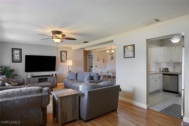 Living area featuring light wood-style flooring, c