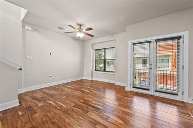 Unfurnished room featuring wood finished floors and ceiling fan