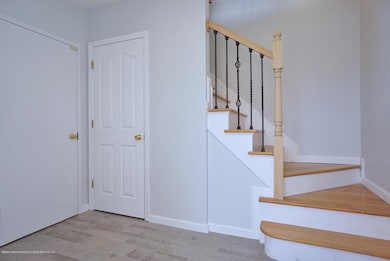 Foyer with door to garage and basement