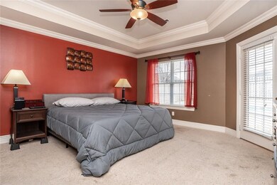 Private master bedroom retreat offers tray ceiling