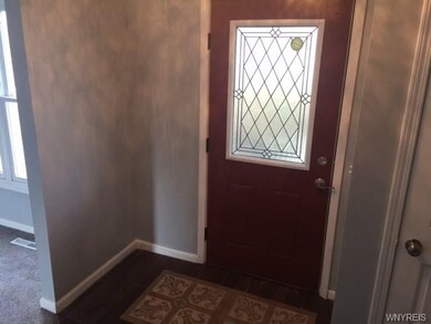 beautiful ceramic tiled entry way with coat closet