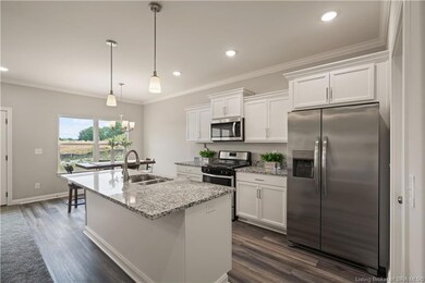 Beautiful open kitchen with abundance of cabinets.