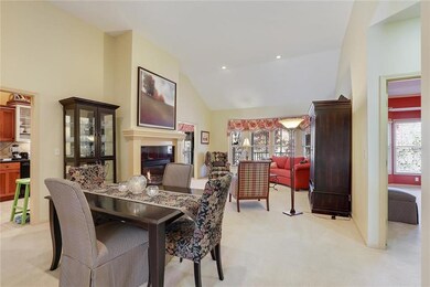 Open floor plan with vaulted ceiling