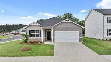 Craftsman-style house featuring a garage and a fro