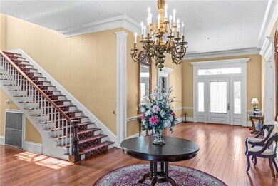 Looking to the front entrance from rear hallway.