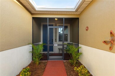 Closed in entry way with beautiful landscaping lea