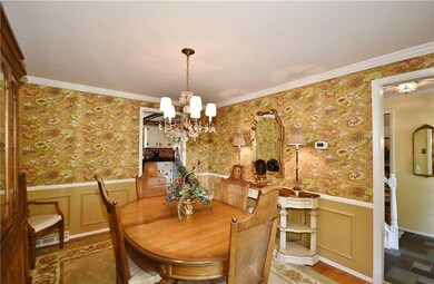 Formal dining room large enough to accommodate Tha