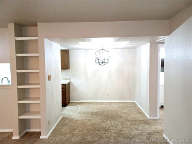 Nice shelving in living area which is open to the