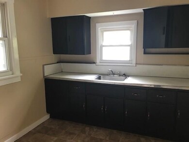 Kitchen cabinets have been painted and new floorin