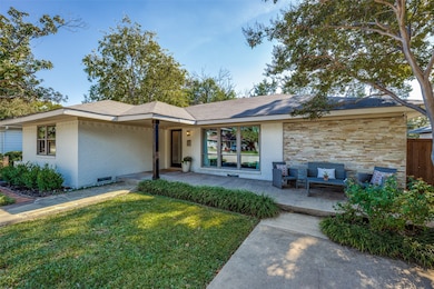 Mature trees, custom stone paved walkway, exterior paint, new windows.