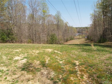 Cleared land under power line on site.