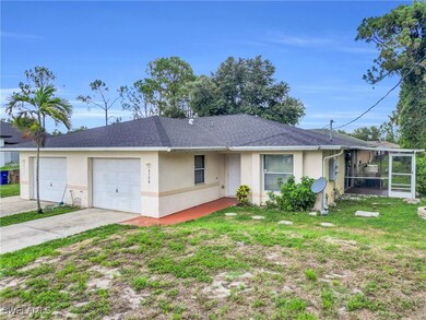 View of front of property with stucco siding, an a