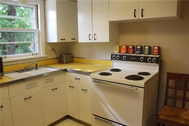 The bright and sunny kitchen is laid out convenien