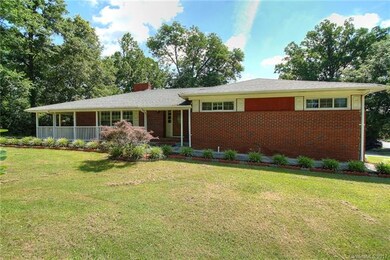 Home has wrap around porch, sunroom addition, and 